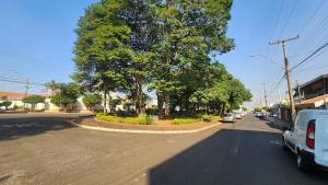 a street with cars parked on the side of the road at RXS Hostel in Colina