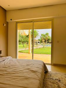 Postel nebo postele na pokoji v ubytování Séjour idéal a Marrakech - Villa spacieuse tout confort