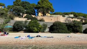 a group of people laying on a beach at CASA DEL CORSO in Dorgali +68 photos