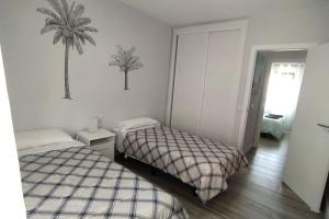 Postel nebo postele na pokoji v ubytování Apartamento Refugió del Mar