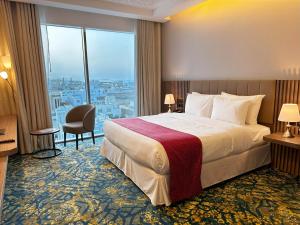 Postel nebo postele na pokoji v ubytování Sur Grand Hotel + 37 fotografií