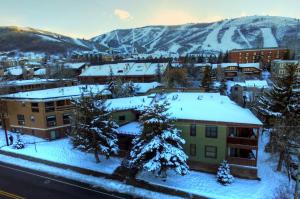 a town covered in snow with mountains in the background at Ski Team 1 in Park City