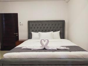 Postel nebo postele na pokoji v ubytování Carstenzs Home Kuta