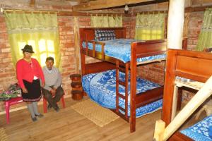 Postel nebo postele na pokoji v ubytování Hostal La Rosita