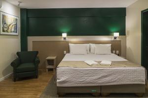 Cama ou camas em um quarto em Hotel Fioreze Origem
