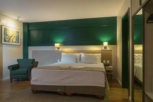 Cama ou camas em um quarto em Hotel Fioreze Origem