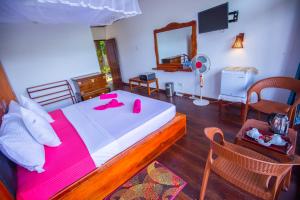 Voodi või voodid majutusasutuse Ella Rawana Den Hotel toas