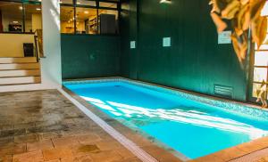 A piscina localizada em Hotel Fioreze Origem ou nos arredores