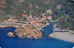 an aerial view of a resort on a mountain at Appartement maison de village à Ota-Porto in Porto Ota