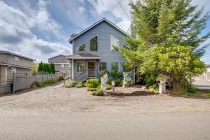 a blue house with a driveway at Relaxing Lincoln City Coastal Escape Near Beach! in Lincoln City
