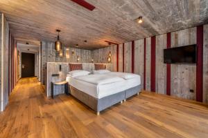Ένα ή περισσότερα κρεβάτια σε δωμάτιο στο Hotel Fanes