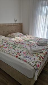 Postel nebo postele na pokoji v ubytování Rooms & Apartment Mama Mia