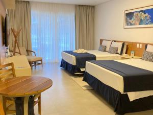 Cama ou camas em um quarto em Beach Hotel Juquehy