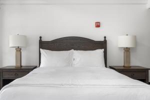 a white bed with two nightstands and two lamps at Santa Rosa Stonehouse Private Wine Country Retreat! in Bak +35 photos