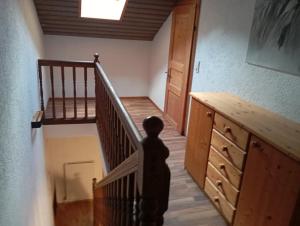 a person walking down a staircase in a room at Ferienwohnung Maier in Mittersill