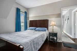 a bedroom with a large bed and a window at Steps from Journeyman in Downtown Valparaiso in Valparaiso