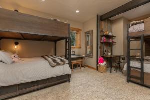 a bedroom with two bunk beds and a desk at Mountain Retreat in Frisco +60 photos