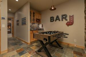 a kitchen with a bar sign on the wall at Mountain Retreat in Frisco