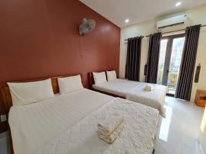 Postel nebo postele na pokoji v ubytování Motel Happy House Nhơn Trạch