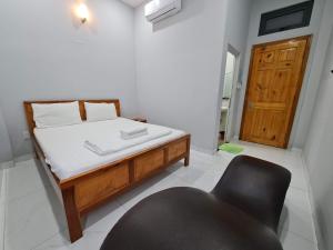Postel nebo postele na pokoji v ubytování Motel Happy House Nhơn Trạch