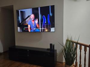 a flat screen tv sitting on a wall at Tranquility Residence in Apple Valley