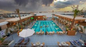 an overhead view of a swimming pool on a building at Boudl Al Sahafa in Riyadh