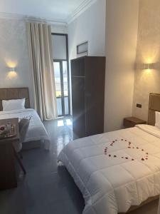 Postel nebo postele na pokoji v ubytování Hotel De Provence
