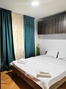 Ένα ή περισσότερα κρεβάτια σε δωμάτιο στο Apartament 1 Mai - Sara