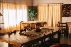 a wooden table with a bowl on top of it at Estancia Quillen Lodge - Hosteria in Aluminé