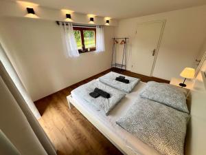 Postel nebo postele na pokoji v ubytování Gartenloft