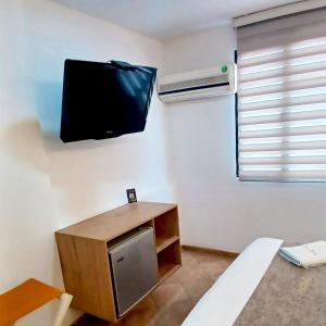 TV a/nebo společenská místnost v ubytování Hotel Cabo de la Vela Medellin