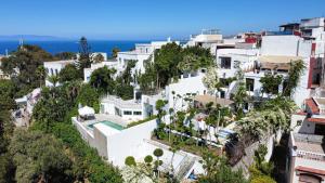 an aerial view of a city with white buildings at Mar y Montana House in Tangier