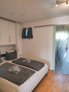 a bedroom with a bed and a window at Apartment Waldkauz in Bad Lauterberg