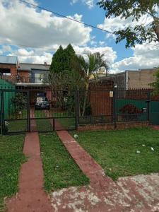 a wrought iron fence in a yard with a driveway at RoMalandya in Villa Dolores
