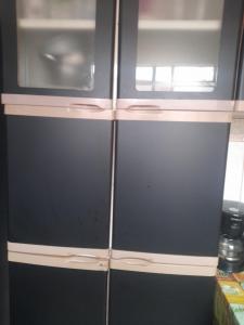 two refrigerators with their doors open in a kitchen at Casa Cinza in São Gonçalo