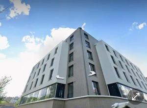 a tall building with arrows on the side of it at A4-16 Studio Cosy Toulouse in Toulouse