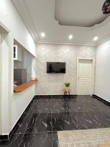 Μια τηλεόραση ή/και κέντρο ψυχαγωγίας στο Appartement Prestige Avec Balcon