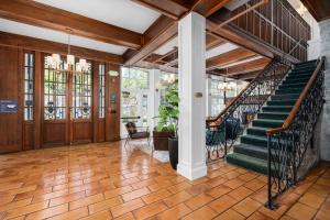 a hallway with a staircase in a house at Santa Rosa Stonehouse Private Wine Country Getaway in Bak +31 photos