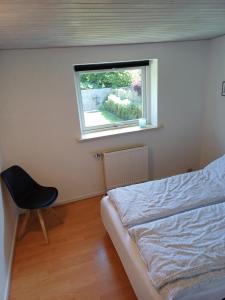 Bjergby Sønderbo feriehus客房内的一张或多张床位
