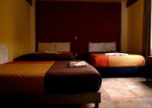 Postel nebo postele na pokoji v ubytování Hotel Casa Rus