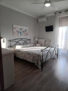 Ένα ή περισσότερα κρεβάτια σε δωμάτιο στο CasaZebe Donoratico