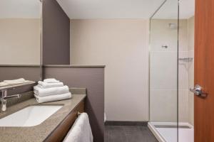 a bathroom with a sink and a shower at Courtyard Missoula in Missoula