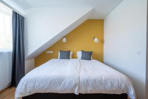 Postel nebo postele na pokoji v ubytování Hotel Breiddalsvik