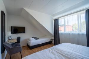 Postel nebo postele na pokoji v ubytování Hotel Breiddalsvik