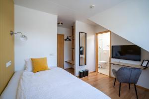 TV a/nebo společenská místnost v ubytování Hotel Breiddalsvik