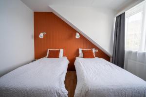 Postel nebo postele na pokoji v ubytování Hotel Breiddalsvik