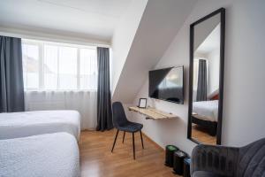 Postel nebo postele na pokoji v ubytování Hotel Breiddalsvik