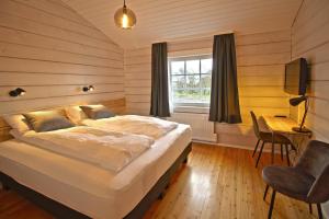 Postel nebo postele na pokoji v ubytování Hotel Breiddalsvik