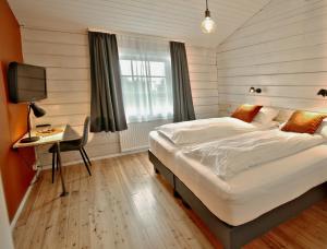 Postel nebo postele na pokoji v ubytování Hotel Breiddalsvik