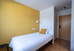 Postel nebo postele na pokoji v ubytování Hotel Breiddalsvik